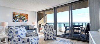 A Proper Beach Getaway with this 1 bedroom condo with Breathtaking views! Beach View! Can book with adjacent condo for larger group! Pool, Fitness Center, Private Beach, Tennis and Wifi available!