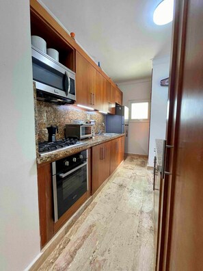 Fridge, cookware/dishes/utensils, dining tables