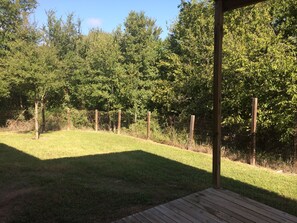 Step out onto the deck and enjoy the serene surroundings of this peaceful outdoor space.