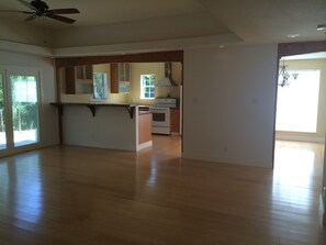 Enjoy cooking in this well-equipped kitchen with a central island, oven, and refrigerator.