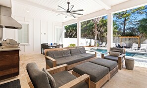 A spacious living area with a pool, outdoor seating, and a patio. - Gulf Views, Saltwater Pool, Steps to 30A Beach Access, Bikes and LSV Included (Santa Rosa Beach)
