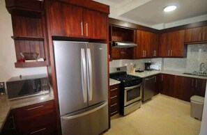 Fridge, cookware/dishes/utensils, dining tables