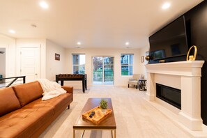 Smart TV, fireplace, foosball