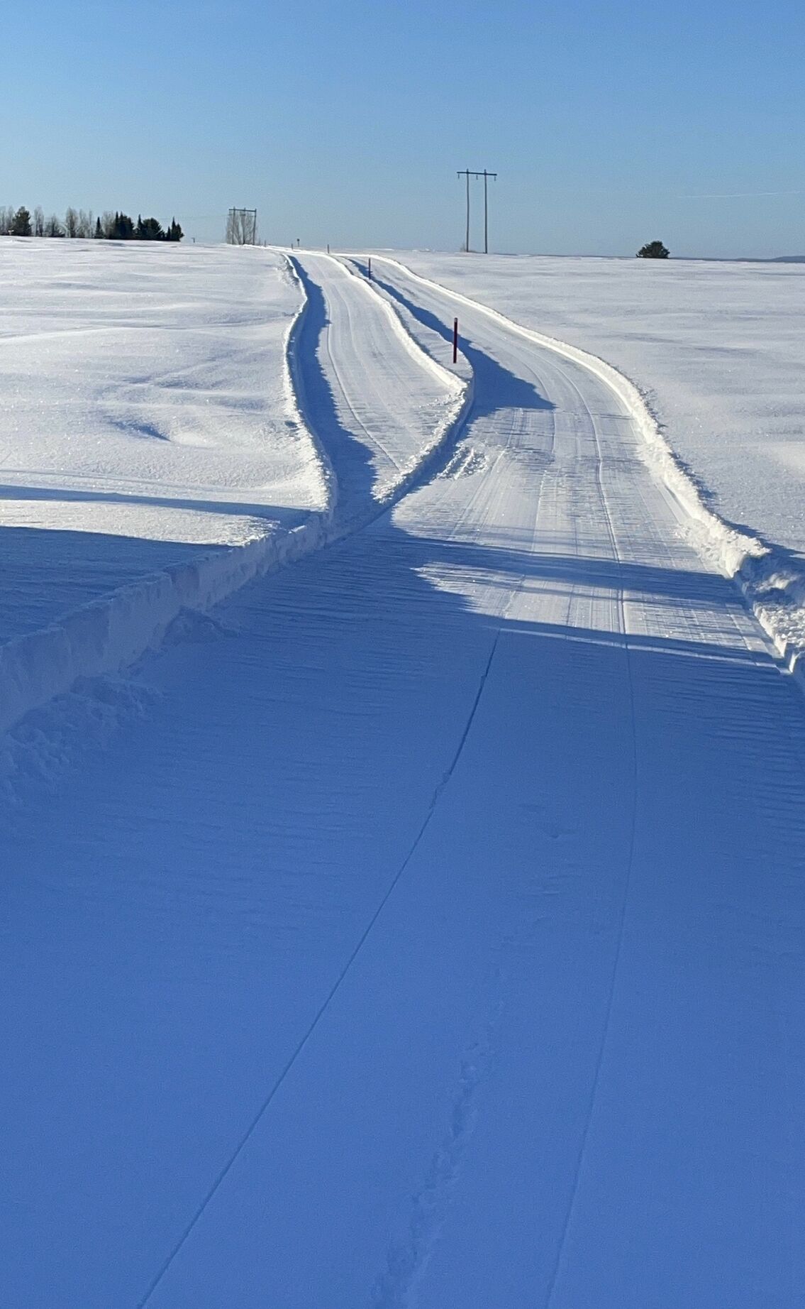 A snow-covered landscape with a clear sky.