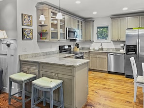 Open kitchen with all the amenities + Bar Seating for 2