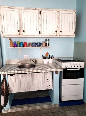 Fridge, cookware/dishes/utensils, dining tables