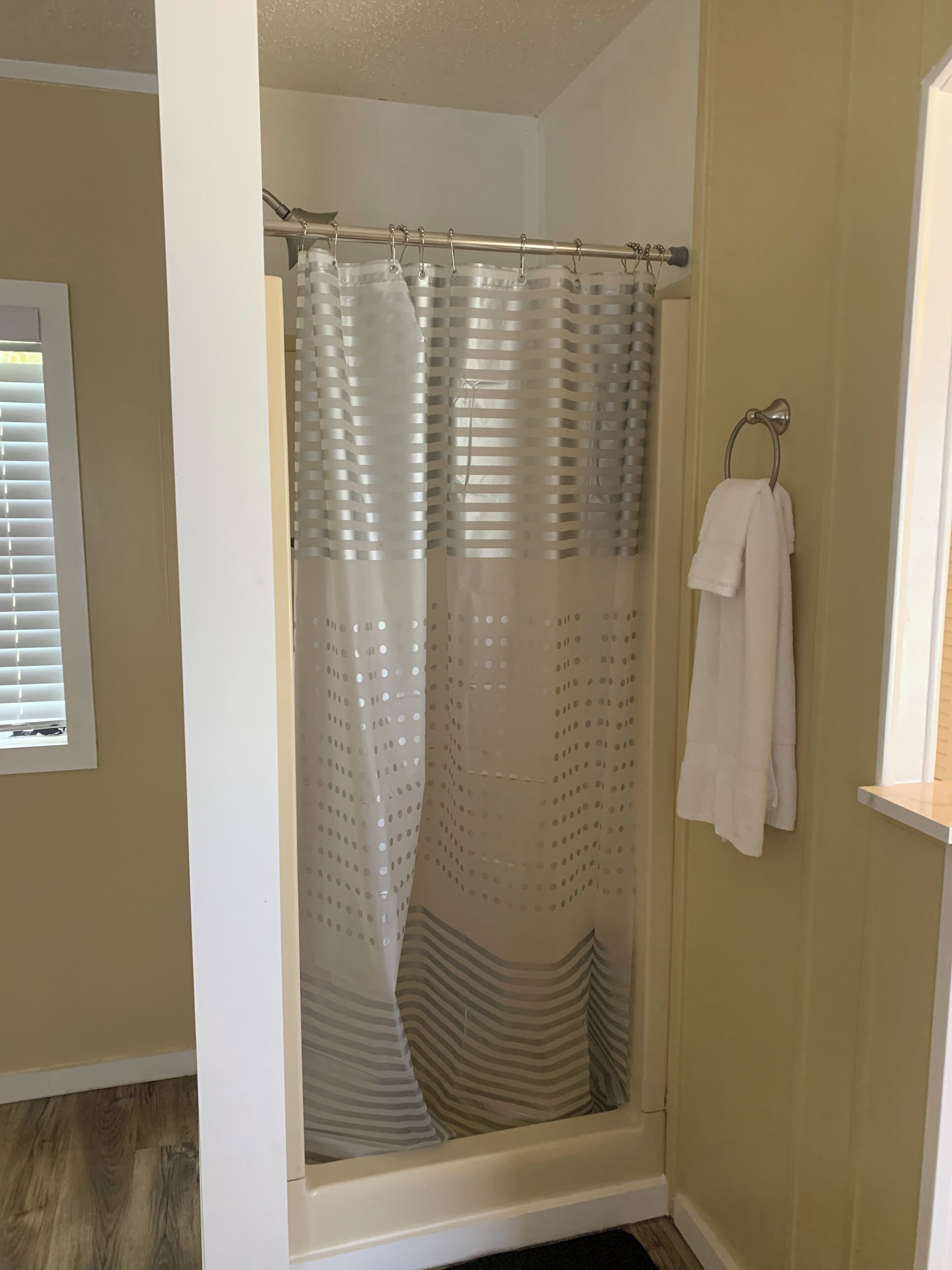 Combined shower/tub, hair dryer, towels, soap