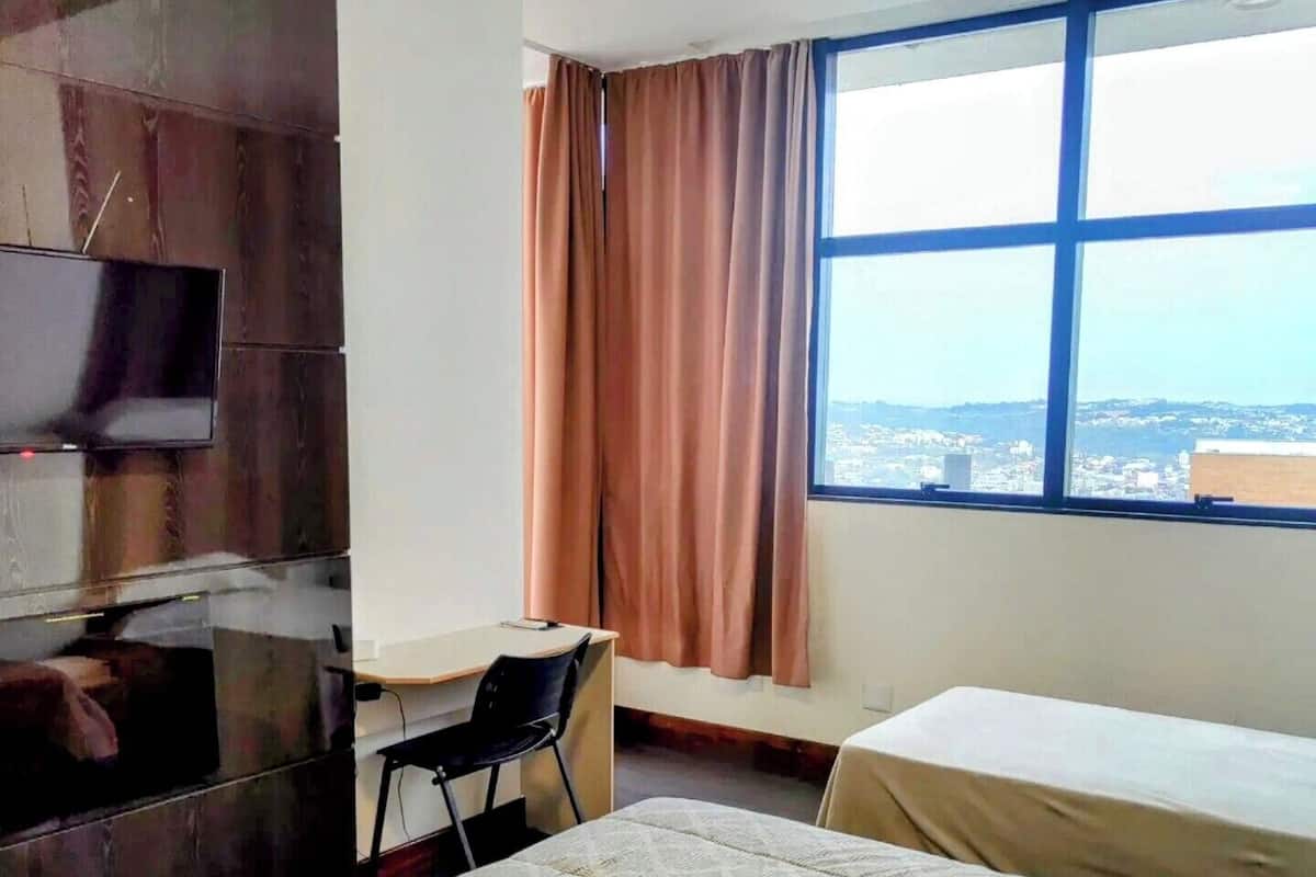 Comfort Room, Multiple Beds, Private Bathroom, City View | Minibar, desk, laptop workspace, free WiFi