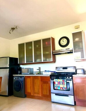 Fridge, cookware/dishes/utensils, dining tables