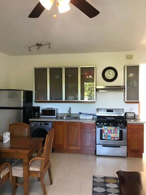 Fridge, cookware/dishes/utensils, dining tables