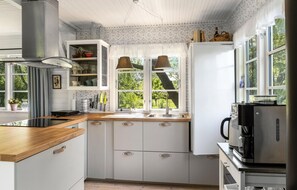 Fridge, stovetop, coffee/tea maker, cookware/dishes/utensils
