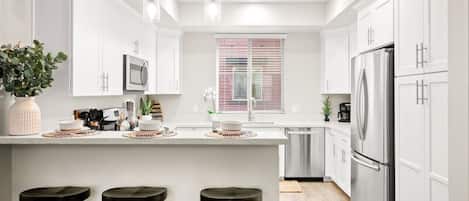 Coffee/tea maker, fridge, microwave, oven
