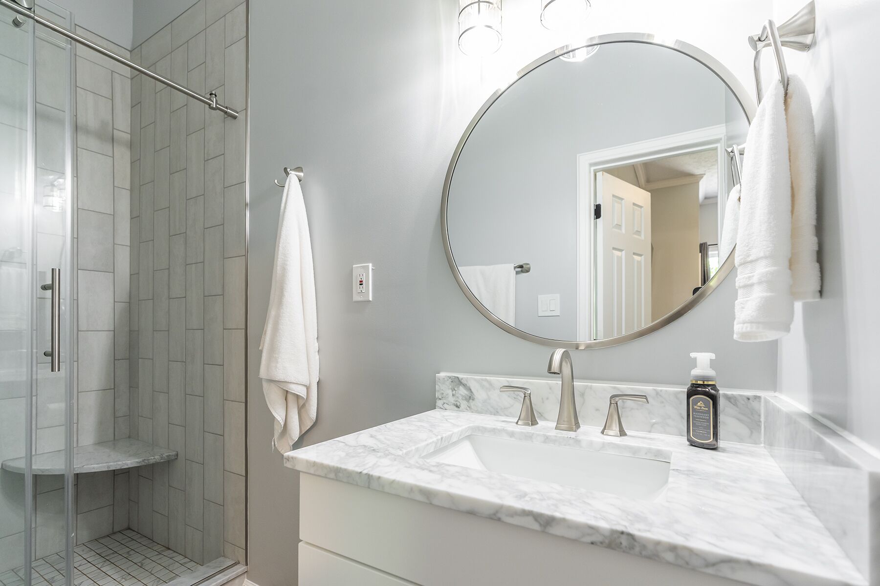 Shower, hair dryer, towels, toilet paper