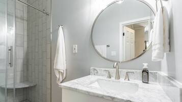 Shower, hair dryer, towels, toilet paper