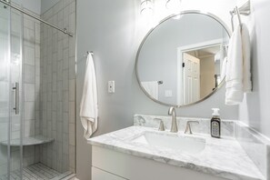 Shower, hair dryer, towels, toilet paper