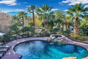 A swimming pool with a hot tub, surrounded by palm trees and a mountainous backdrop. - Natural Springs-2 acre, Games+karaoke, fit,views. (Riverside County)
