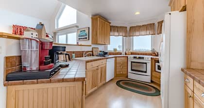 Exquisite home with spectacular views, deck, gas fireplace & game room