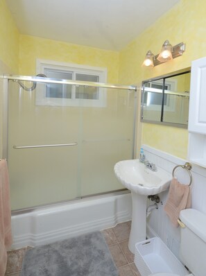 Combined shower/tub, hair dryer, towels, soap