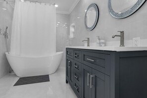 Combined shower/tub, hair dryer, towels, soap