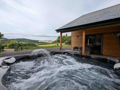Unique 3 bed cabin with hot tub on Welsh border.