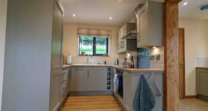 Unique 3 bed cabin with hot tub on Welsh border.