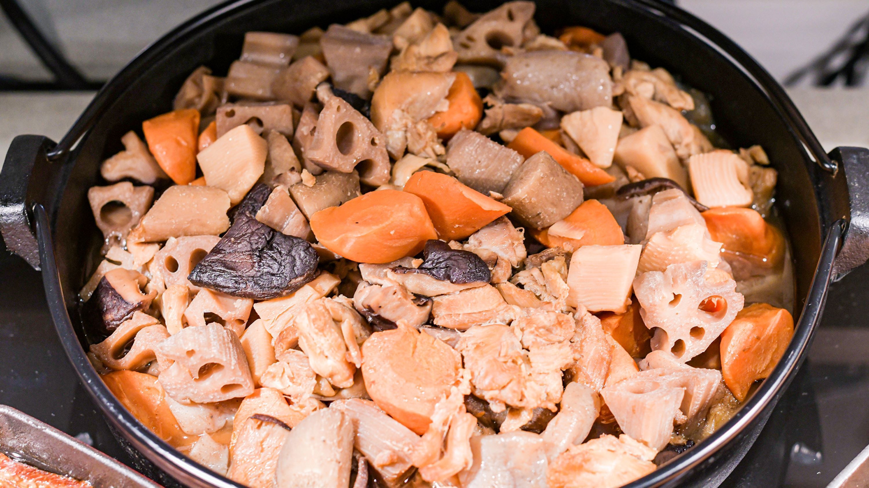A close-up of a cooking pot with various ingredients.