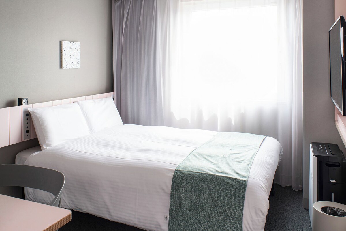Down comforters, laptop workspace, blackout drapes, soundproofing