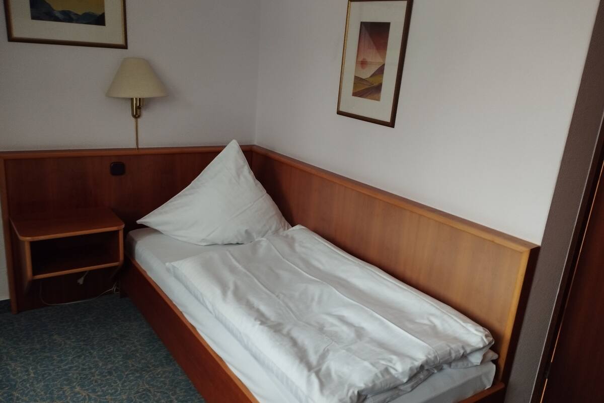 Single Room | Desk, blackout drapes, iron/ironing board (on request), travel crib