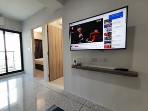 Departamento Deluxe | Área de sala de estar | Smart TV