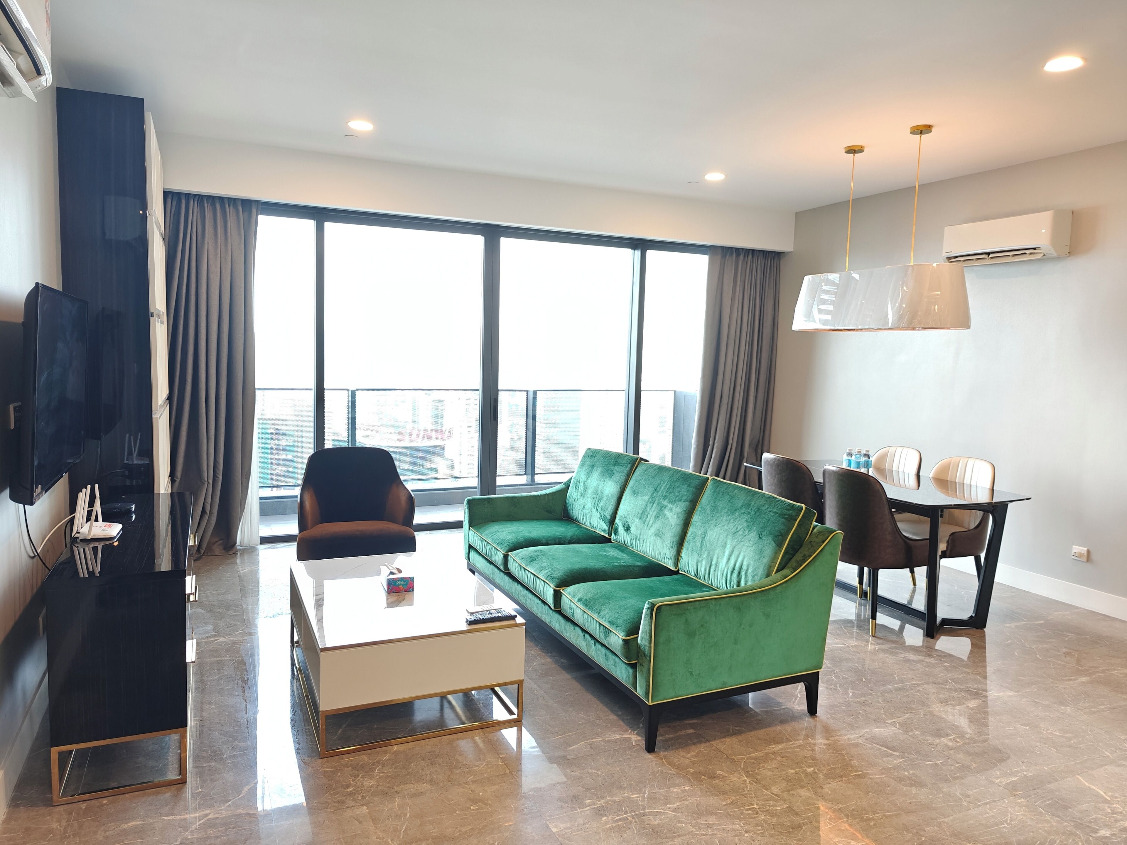 Premium Apartment | Living area | 50-inch Smart TV with satellite channels
