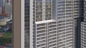 A modern high-rise building with a grid-like facade and the name "ATINU" prominently displayed at the top. - Victory suites  (Kuala Lumpur)