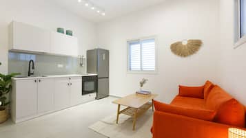 City Apartment | Living room | 42-inch flat-screen TV with digital channels, TV, Netflix