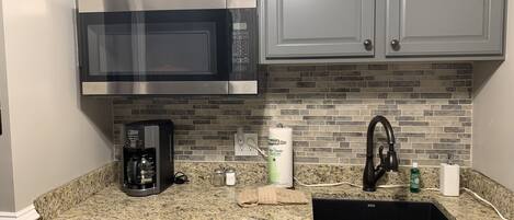 Fridge, microwave, stovetop, coffee/tea maker