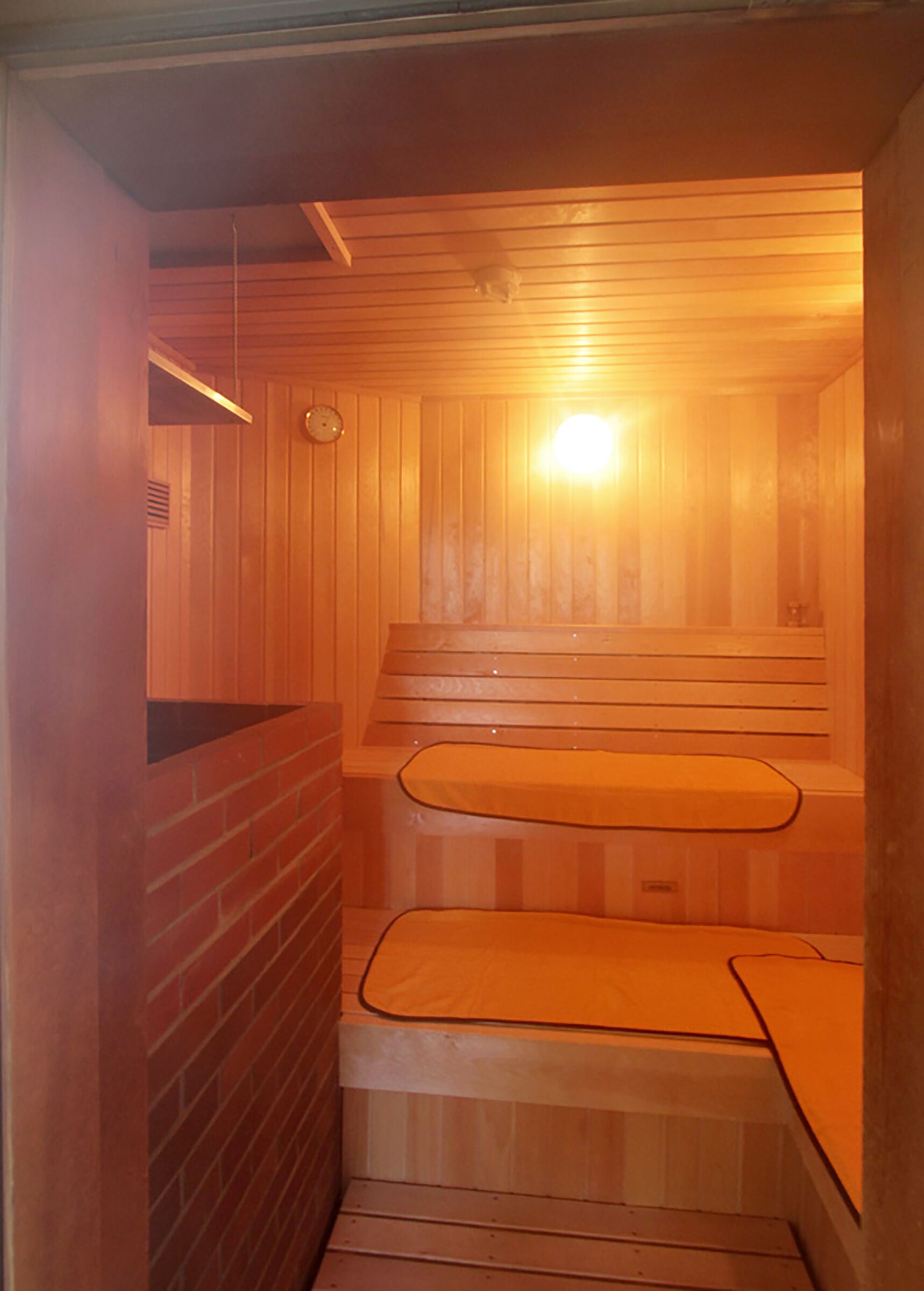 A sauna with wooden walls and benches.