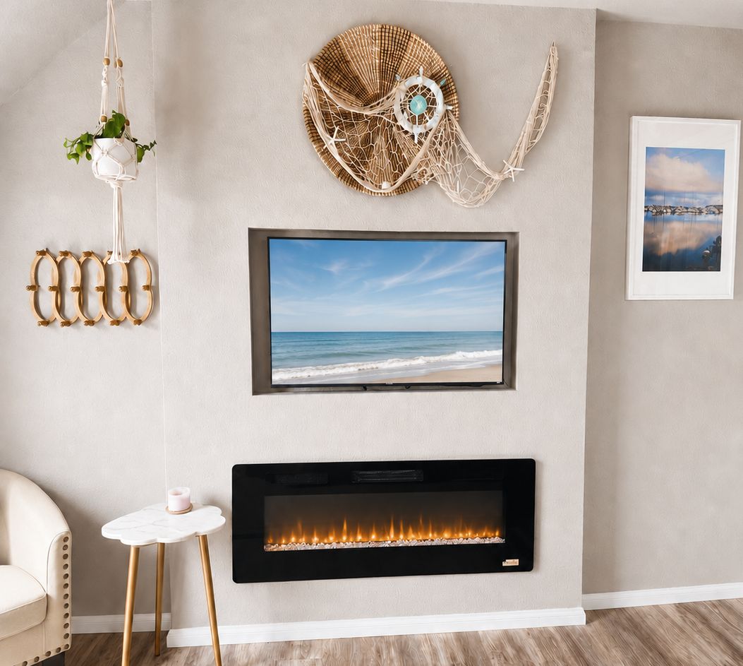 A living room with a flat-screen TV mounted above a fireplace, a wall-mounted decorative item, and a framed picture.