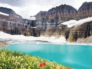 Surrounded by layered rock formations and lush vegetation, this serene lake offers a tranquil escape for nature lovers and photographers.