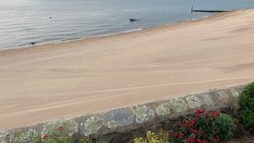 On the beach, sun-loungers, beach towels