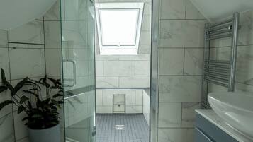 Shower, hair dryer, towels, soap
