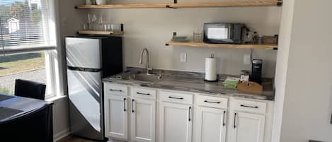 Fridge, microwave, stovetop, coffee/tea maker