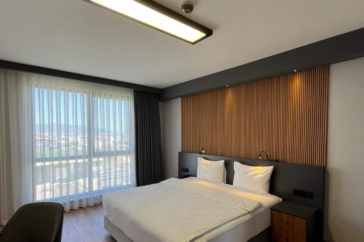 Deluxe kamer | 1 slaapkamer, een minibar met enkele gratis items, een kluis op de kamer