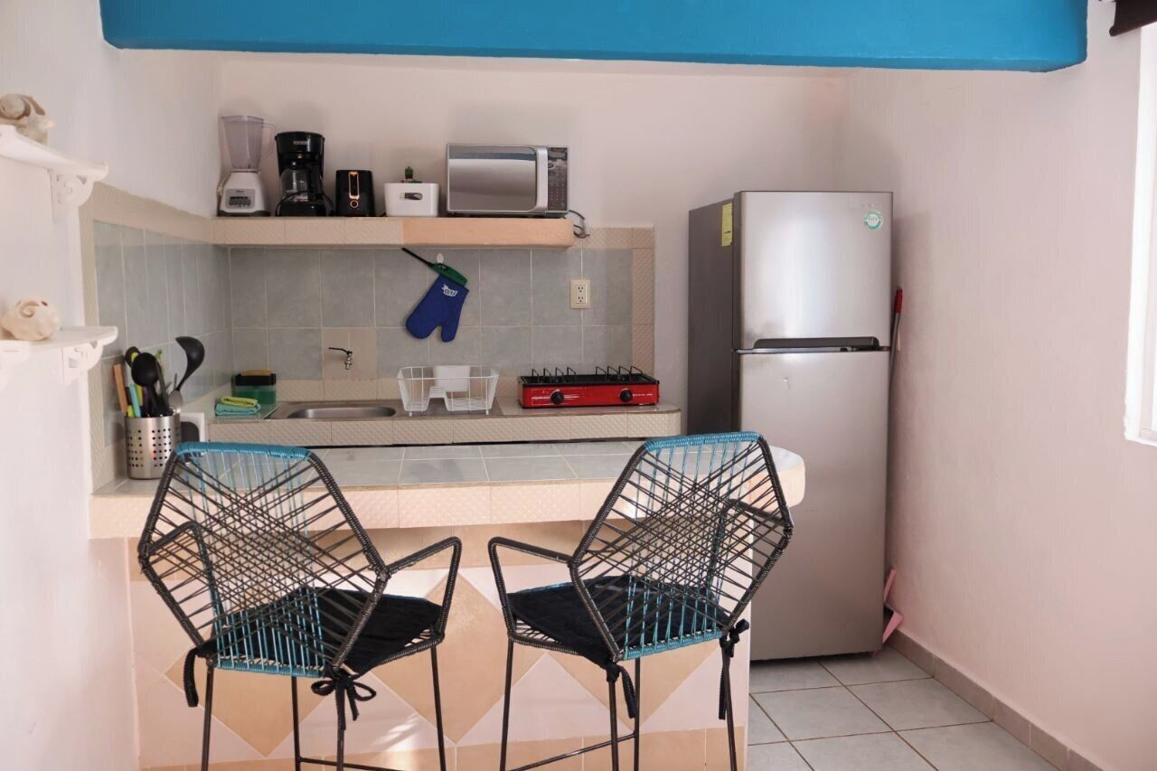 Fridge, microwave, stovetop, coffee/tea maker