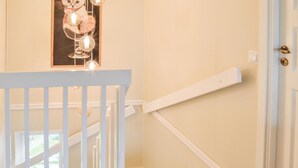A staircase with white railings and a light-colored wall. - Beautiful home in Gnesta with WiFi (Gnesta)
