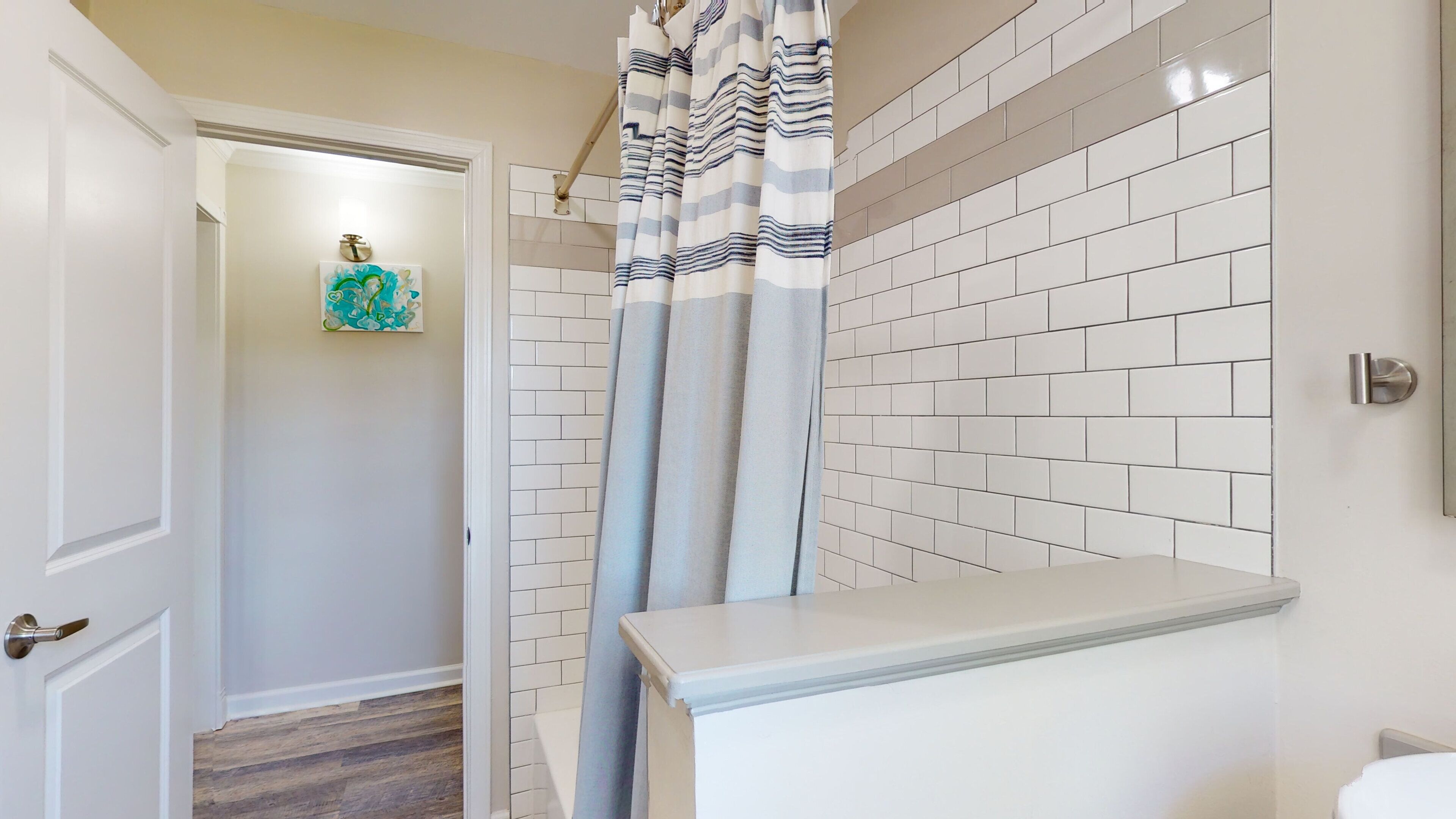 Combined shower/bathtub, towels, soap, toilet paper