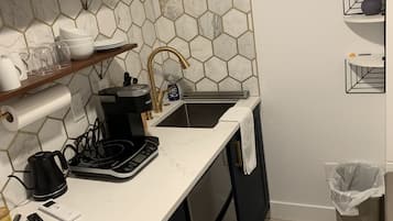 Fridge, coffee/tea maker, electric kettle, cookware/dishes/utensils