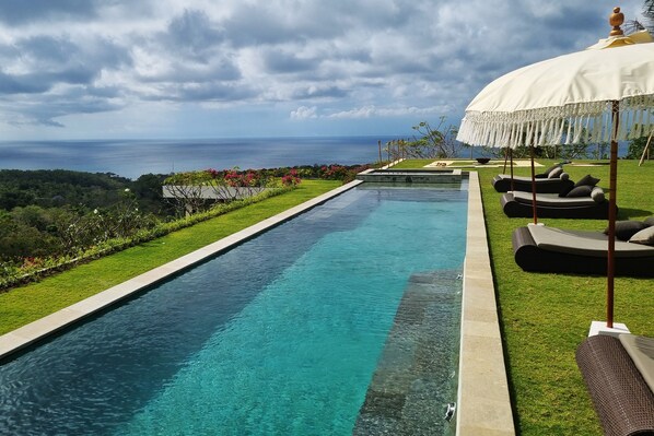 Outdoor pool, pool umbrellas, pool loungers