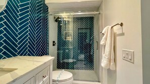 Shower, towels, soap, toilet paper