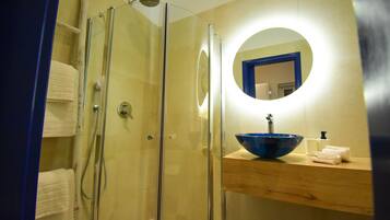 Shower, hair dryer, towels, toilet paper