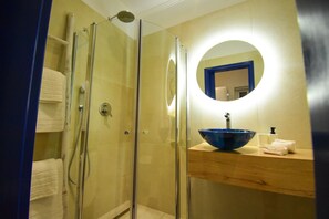 Shower, hair dryer, towels, toilet paper