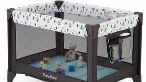 A PamoBabe playpen with a mesh enclosure, a padded floor, and a safety gate. - Downtown Sarasota Florida Vacation Rental 3BR/1.5BA House, Near Beaches, Unit 1 (Sarasota)