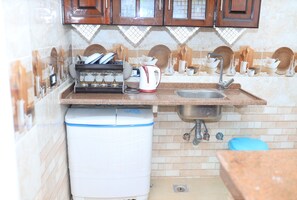 Royal Apartment | Private kitchen | Full-size fridge, coffee/tea maker, rice cooker, griddle